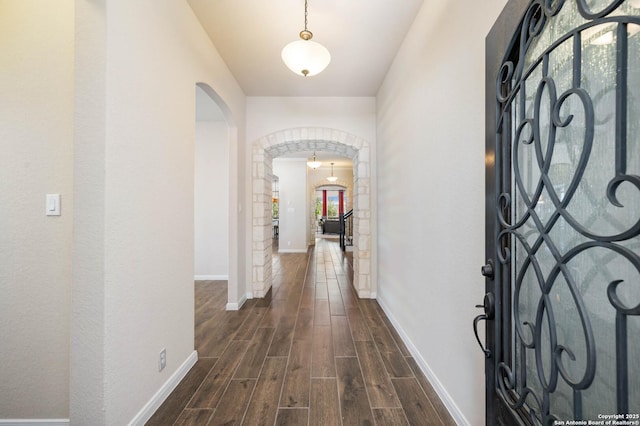 25318 Pleasant Bch, San Antonio, TX 78255 - foyer with arched walkways, dark wood finished floors, and baseboards