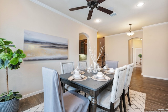 25318 Pleasant Bch, San Antonio, TX 78255 - dining space with arched walkways, ornamental molding, baseboards, wood finished floors, and recessed lighting