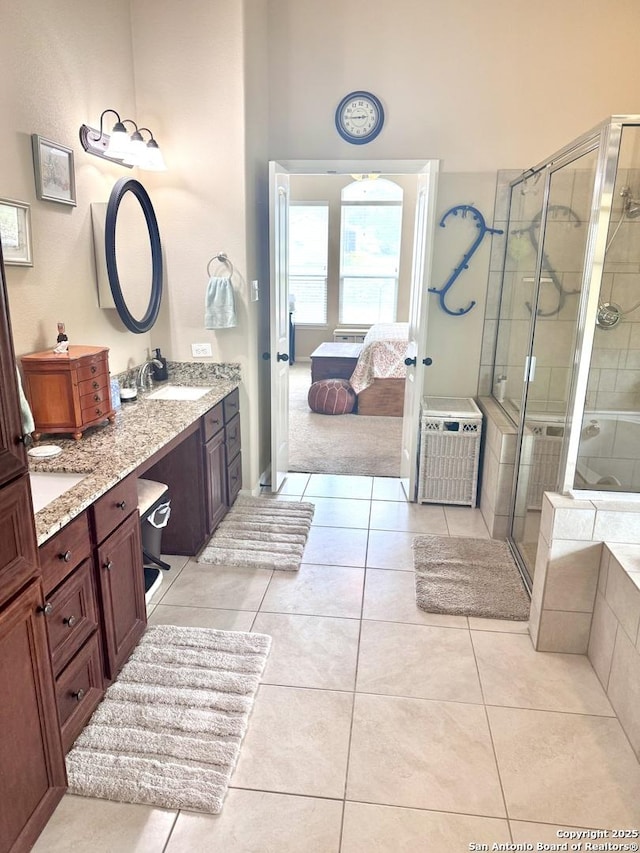 187 Tracks Trl, Center Point, TX 78010 - ensuite bathroom featuring a stall shower, vanity, and tile patterned floors