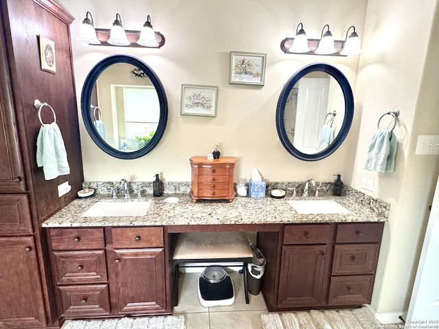 187 Tracks Trl, Center Point, TX 78010 - full bath featuring double vanity and tile patterned floors