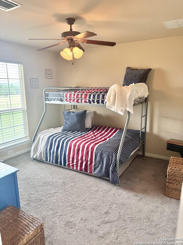 187 Tracks Trl, Center Point, TX 78010 - bedroom featuring carpet flooring, baseboards, and a ceiling fan