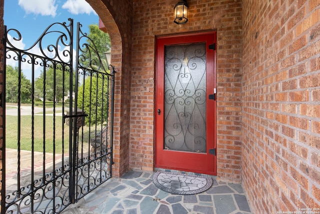 2150 W Summit Ave, San Antonio, TX 78201 - doorway to property with a gate and brick siding