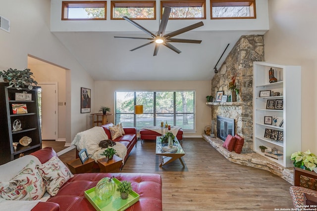 8537 Classic Oaks Ln, San Antonio, TX 78255 - living room with ceiling fan, high vaulted ceiling, healthy amount of natural light, a fireplace, and wood finished floors
