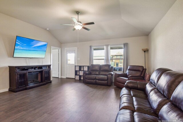 7718 Blue Gulf, San Antonio, TX 78222 - living room with vaulted ceiling, ceiling fan, dark wood-style flooring, and baseboards