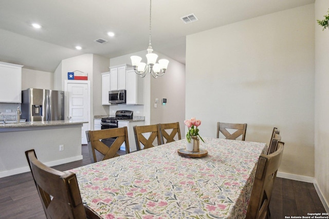 7718 Blue Gulf, San Antonio, TX 78222 - dining area featuring dark wood finished floors, baseboards, a chandelier, recessed lighting, and vaulted ceiling