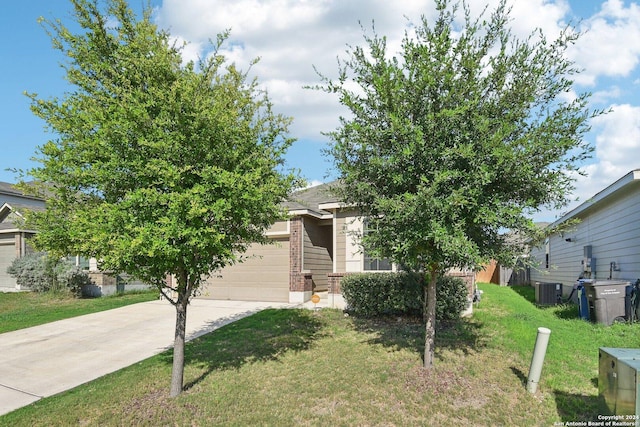 7718 Blue Gulf, San Antonio, TX 78222 - view of property hidden behind natural elements with driveway, a front yard, a garage, cooling unit, and brick siding