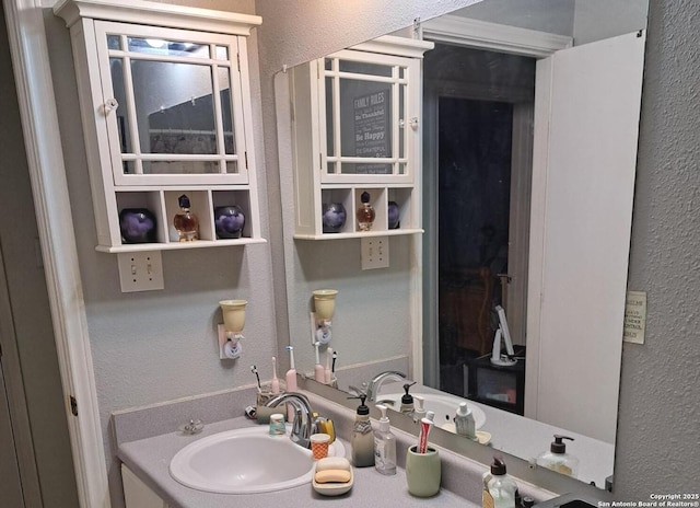 210 Catherine, San Antonio, TX 78237 - bathroom featuring a textured wall and vanity