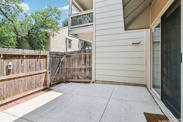 2300 Nacogdoches Rd Unit 164R, San Antonio, TX 78209 - view of patio featuring a balcony and a gate