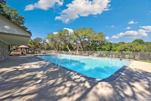 771 Mockingbird, Spring Branch, TX 78070 - community pool with a gazebo, a patio, and view of scattered trees