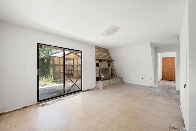 771 Mockingbird, Spring Branch, TX 78070 - unfurnished living room featuring a stone fireplace