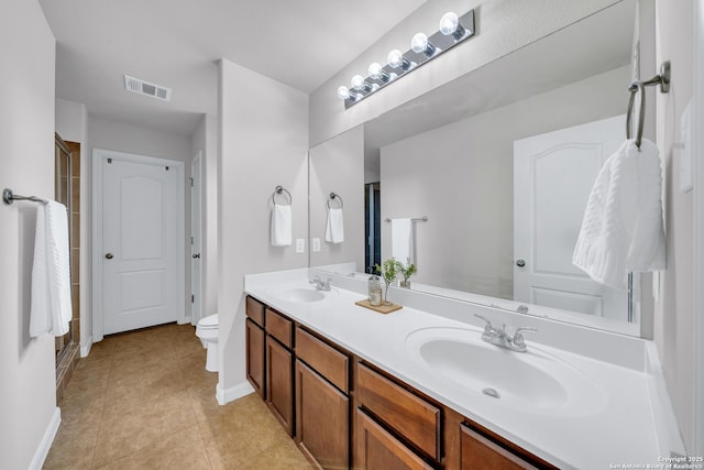 7702 Bit Cir, Elmendorf, TX 78112 - full bathroom featuring baseboards, double vanity, a stall shower, toilet, and tile patterned floors