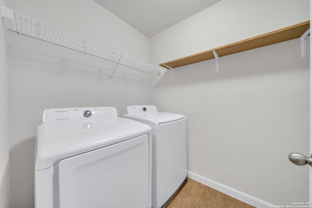 7702 Bit Cir, Elmendorf, TX 78112 - washroom featuring washing machine and clothes dryer, baseboards, and light tile patterned floors