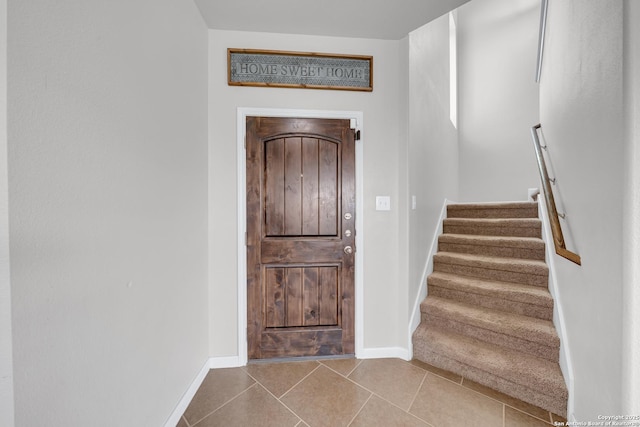 7702 Bit Cir, Elmendorf, TX 78112 - tiled foyer featuring stairs and baseboards