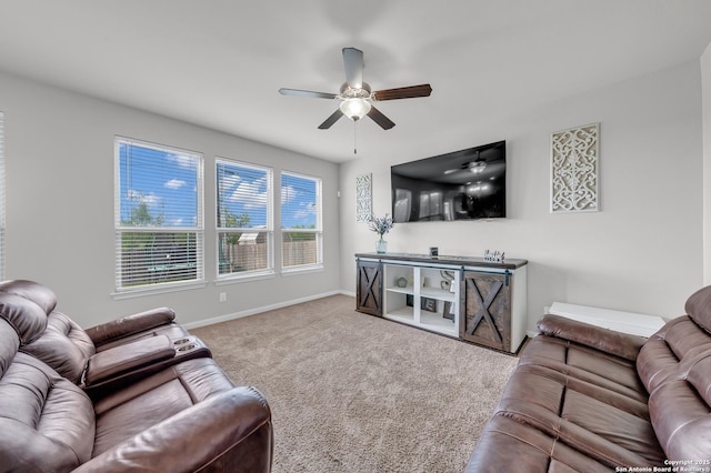 7702 Bit Cir, Elmendorf, TX 78112 - living area featuring a ceiling fan, carpet floors, and baseboards