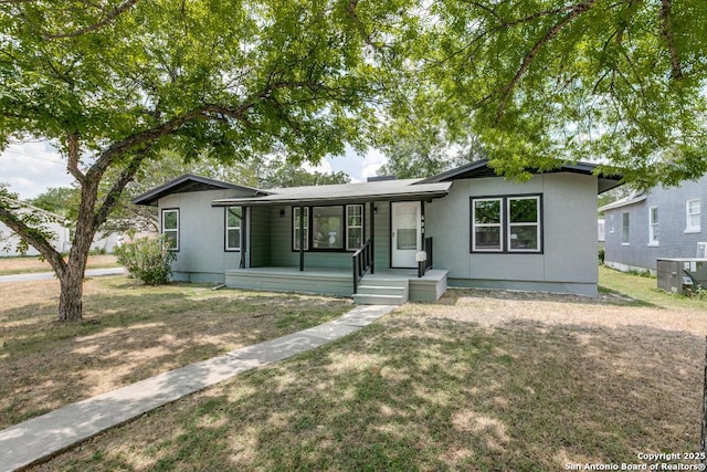 602 John Page, San Antonio, TX 78228 - ranch-style home featuring a porch, a front yard, and central AC