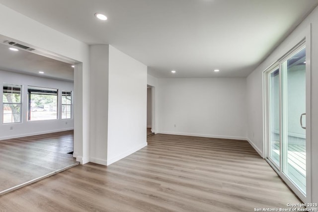 602 John Page, San Antonio, TX 78228 - empty room featuring light wood-style flooring, recessed lighting, and baseboards