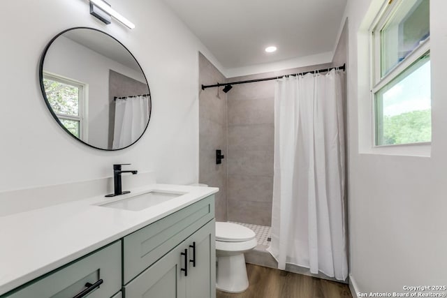 602 John Page, San Antonio, TX 78228 - full bath with vanity, toilet, a tile shower, wood finished floors, and recessed lighting
