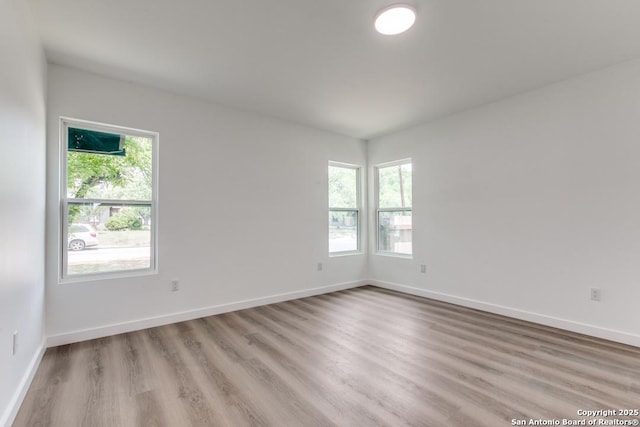 602 John Page, San Antonio, TX 78228 - empty room with wood finished floors and baseboards