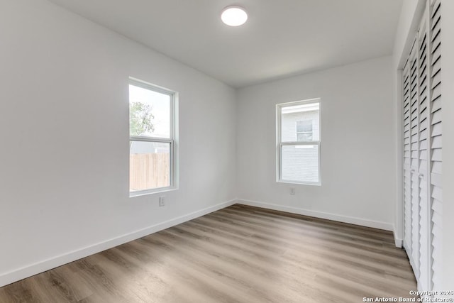 602 John Page, San Antonio, TX 78228 - unfurnished bedroom with light wood-style floors and baseboards