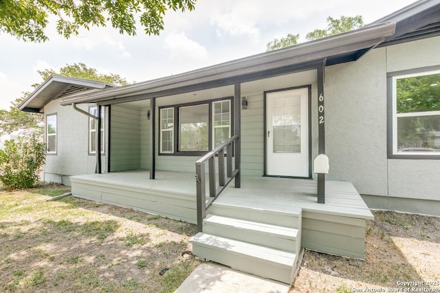 602 John Page, San Antonio, TX 78228 - doorway to property featuring a porch and stucco siding
