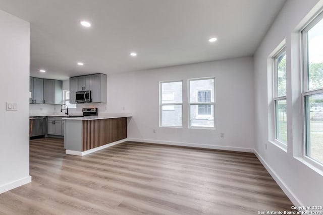 602 John Page, San Antonio, TX 78228 - kitchen with stainless steel appliances, a sink, gray cabinetry, healthy amount of natural light, and recessed lighting