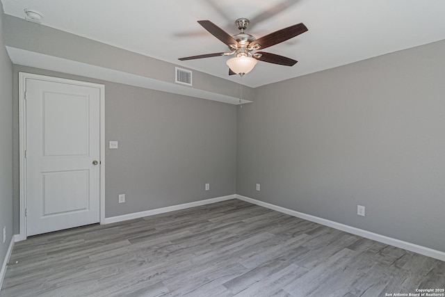 4935 Bartmer Ave, San Antonio, TX 78228 - empty room with a ceiling fan and wood finished floors