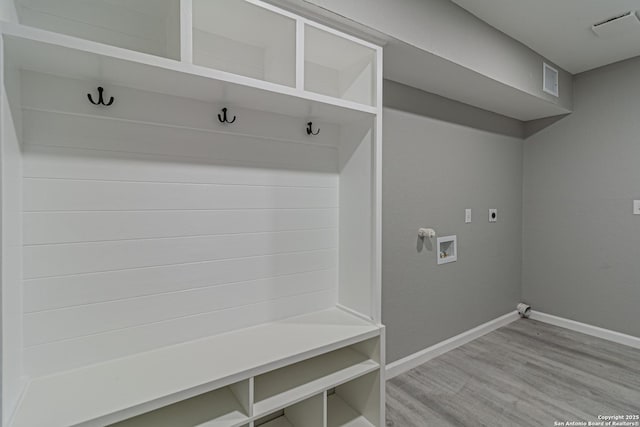 4935 Bartmer Ave, San Antonio, TX 78228 - mudroom featuring baseboards and light wood-style floors