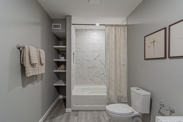 4935 Bartmer Ave, San Antonio, TX 78228 - bathroom featuring wood finished floors and shower / tub combo
