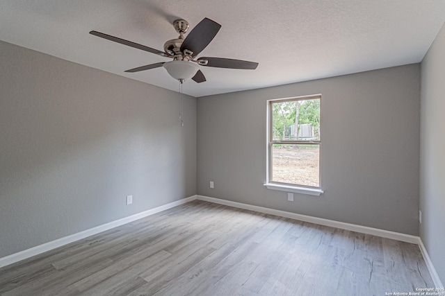4935 Bartmer Ave, San Antonio, TX 78228 - unfurnished room with wood finished floors and a ceiling fan