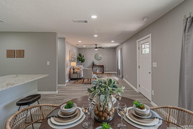 4935 Bartmer Ave, San Antonio, TX 78228 - dining room with light wood-style floors, ceiling fan, and recessed lighting