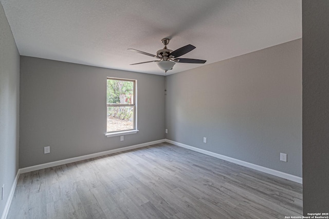 4935 Bartmer Ave, San Antonio, TX 78228 - empty room with wood finished floors, ceiling fan, and a textured ceiling