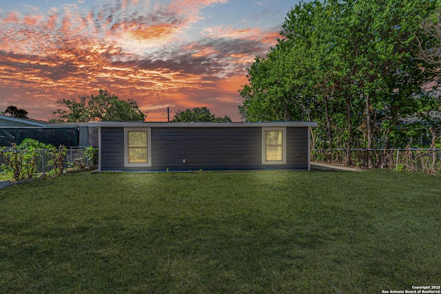 4935 Bartmer Ave, San Antonio, TX 78228 - yard at dusk featuring a fenced backyard