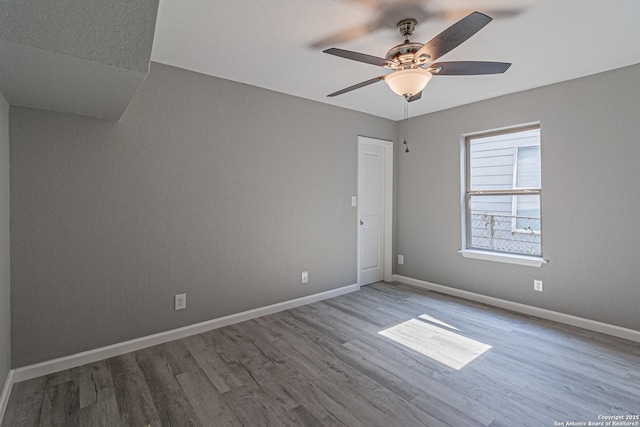 4935 Bartmer Ave, San Antonio, TX 78228 - unfurnished room featuring wood finished floors and a ceiling fan