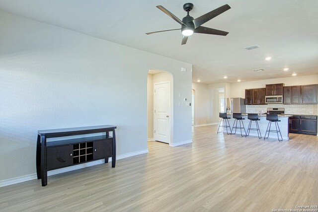 13351 Welsh Pony, San Antonio, TX 78254 - living room with light wood-style floors, a ceiling fan, baseboards, and recessed lighting