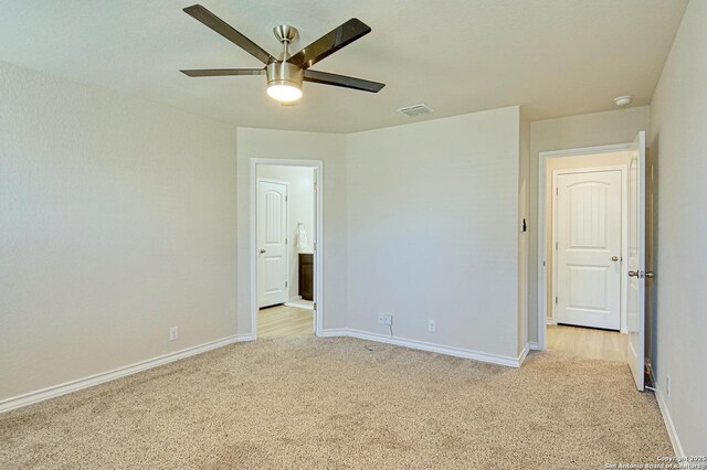 13351 Welsh Pony, San Antonio, TX 78254 - unfurnished bedroom with light colored carpet, baseboards, and ceiling fan