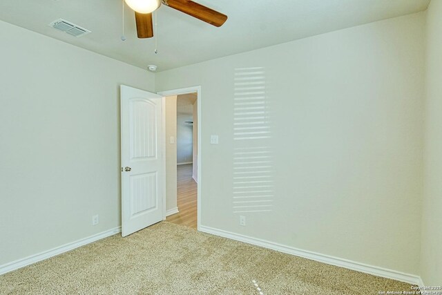 13351 Welsh Pony, San Antonio, TX 78254 - unfurnished bedroom with baseboards, carpet, and a ceiling fan