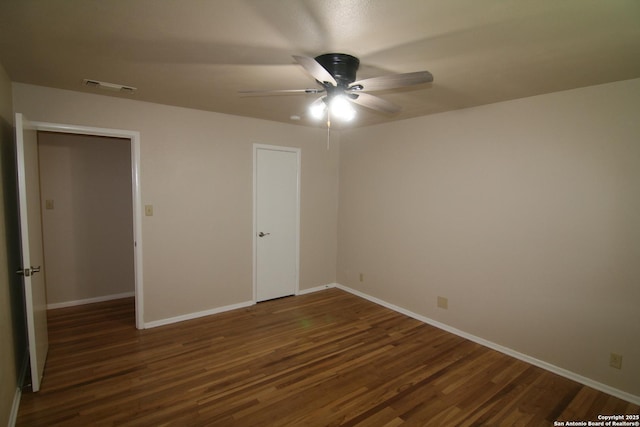 206 Alvina, Castroville, TX 78009 - unfurnished bedroom with wood finished floors, baseboards, and a ceiling fan