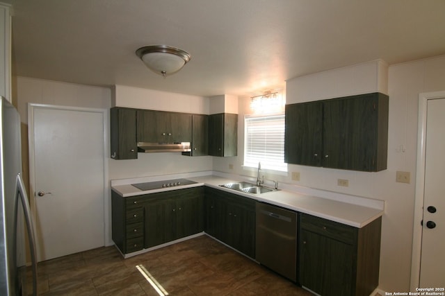206 Alvina, Castroville, TX 78009 - kitchen featuring stainless steel appliances, a sink, light countertops, and under cabinet range hood