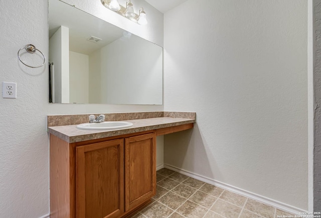 5439 Kensington Run, San Antonio, TX 78228 - bathroom featuring vanity, baseboards, and a textured wall