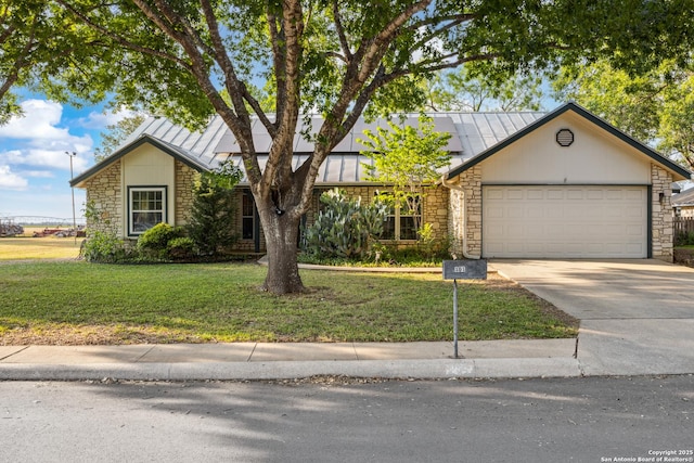 101 Country Ln, Castroville, TX 78009 - view of front of home with stone siding, a standing seam roof, a garage, and concrete driveway