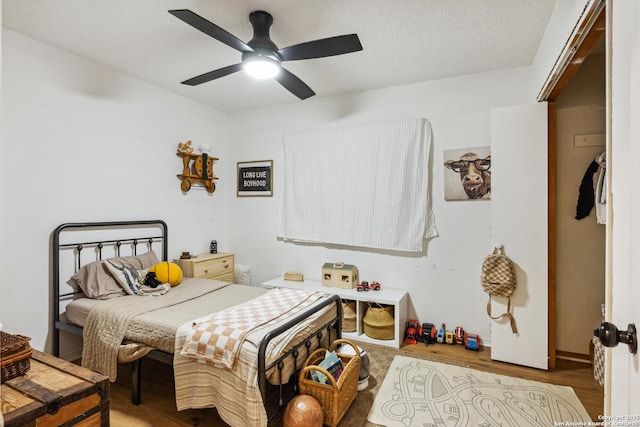 101 Country Ln, Castroville, TX 78009 - bedroom with wood finished floors and ceiling fan