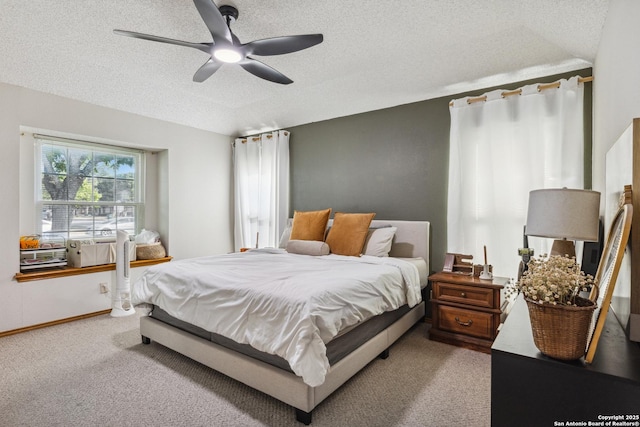 101 Country Ln, Castroville, TX 78009 - carpeted bedroom featuring a textured ceiling and ceiling fan