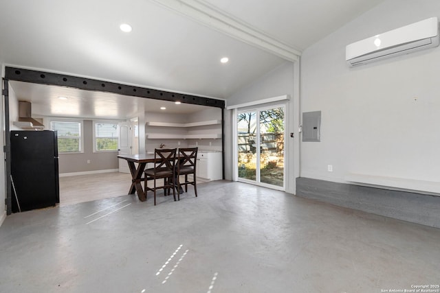 30951 Blanco Rd, Bulverde, TX 78163 - dining room with a wall mounted AC, healthy amount of natural light, electric panel, finished concrete flooring, and vaulted ceiling