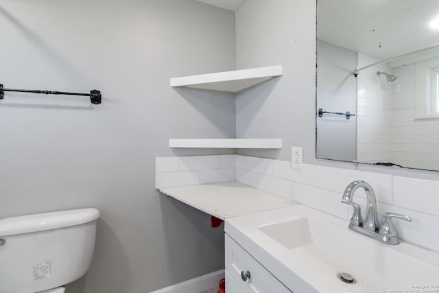 30951 Blanco Rd, Bulverde, TX 78163 - full bathroom featuring vanity, toilet, tasteful backsplash, a shower, and baseboards