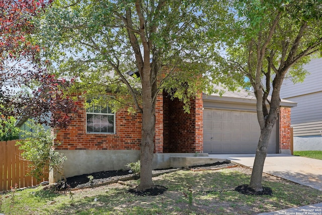 9814 Shawnee, Converse, TX 78109 - view of front of house featuring driveway, brick siding, and an attached garage
