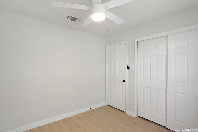 9814 Shawnee, Converse, TX 78109 - unfurnished bedroom with light wood-type flooring, baseboards, a closet, and ceiling fan