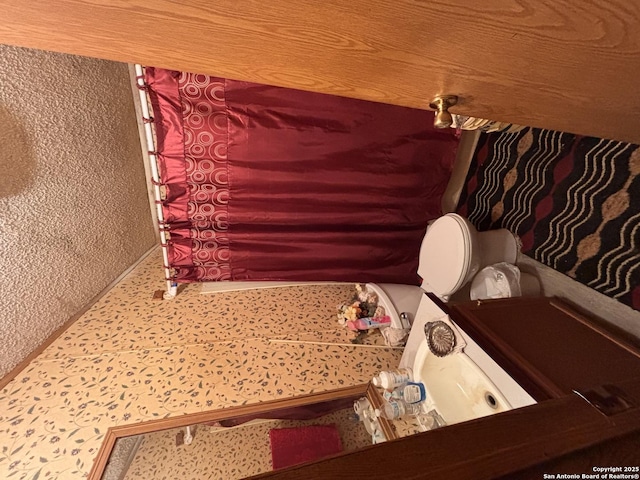 793 Fm 1986, La Pryor, TX 78872 - bathroom with baseboards and toilet