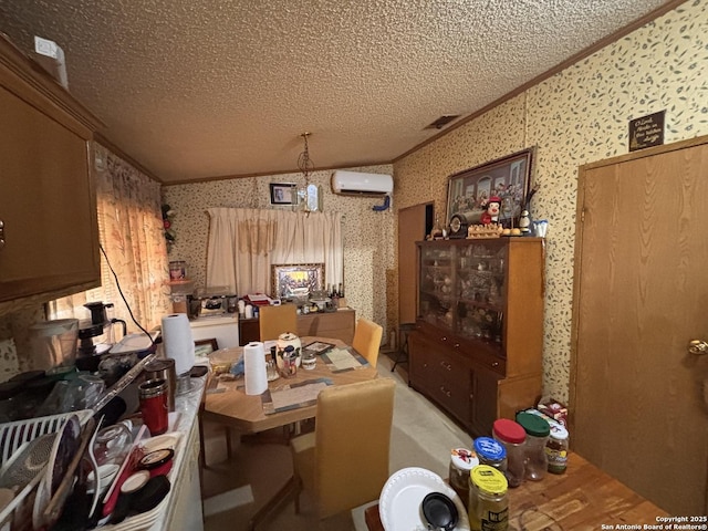 793 Fm 1986, La Pryor, TX 78872 - dining room featuring wallpapered walls, vaulted ceiling, ornamental molding, a wall mounted air conditioner, and a textured ceiling