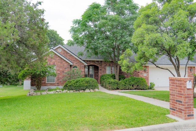 424 Mount Joy, New Braunfels, TX 78130 - view of front of house featuring brick siding, a front yard, a shingled roof, and a garage