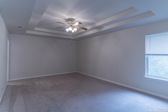 424 Mount Joy, New Braunfels, TX 78130 - empty room with a tray ceiling, ceiling fan, light colored carpet, and baseboards